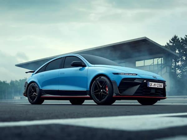 Hyundai IONIQ 6 car in light blue parked on a race track