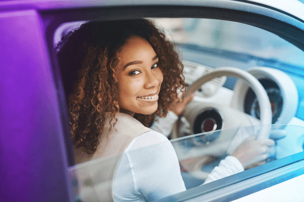 Woman smiling in car